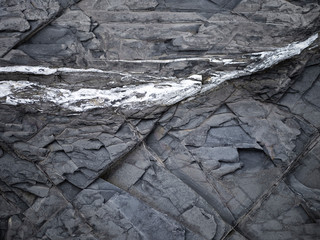 Grunge wall balck stone background textures. Abstract stone pattern from waves erode, nature background. Marble coating