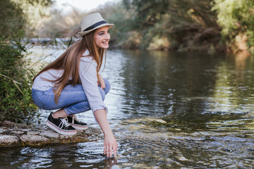 Blonde woman enjoys water in a lake