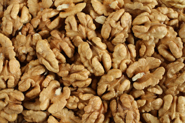 Top view of a pile of big shelled walnuts