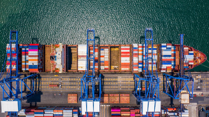 Container ship loading and unloading in deep sea port, Aerial top view of logistic import export...