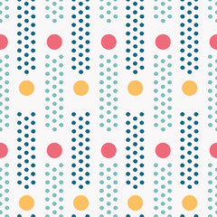 Colorful polka dot seamless pattern with pinpoint dots in columns. Vector. For spring or summer fashion, swimwear, office decor, cards, stationery and textiles. This lively print is so versatile!