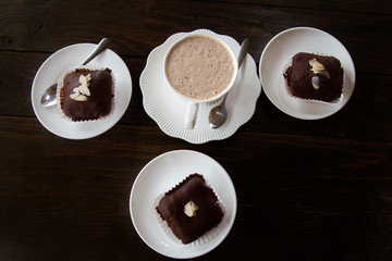 Coffee and cake Placed on a wooden table with a coffee spoon