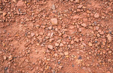 Red Brown Gravel or Soil Texture Background for Design Close up