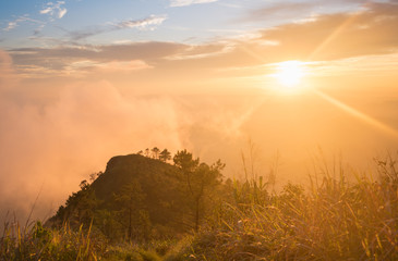 Gold Sunset Light Phu Nom at Phu Langka National Park Thailand with Fog on Sky