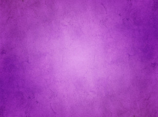 Fototapeta na wymiar An elegant, rich purple, grunge parchment texture background with glowing center. 