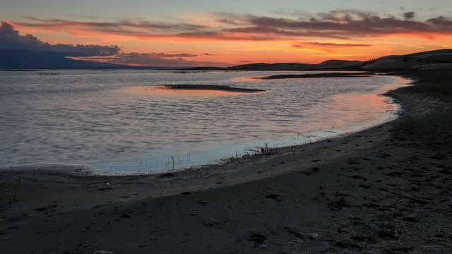 4K. Sunset on the salted lake Durgun Nuur, Mongolia. Ultra HD, 4096x2304