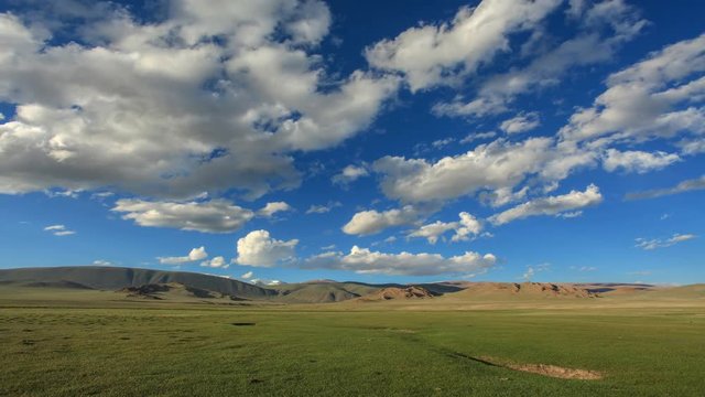 4K. Clouds over the valley of the Tolbo, Mongolia. Ultra HD, 4096x2304