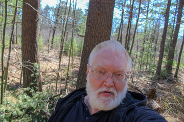 portrait of a senior man in the forest