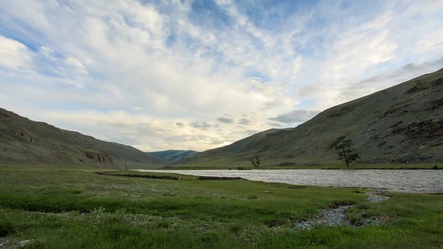 4K. Clouds above the Khovd river, Mongolian Altai, Mongolia. Ultra HD, 4096x2304