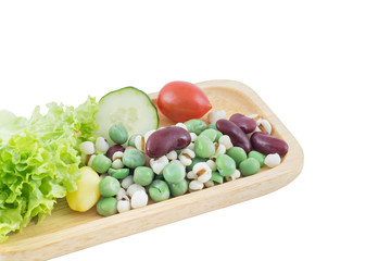 Cereal Grains and fresh vegetable on Wood tray isolated on white background, selective focus (detailed close-up shot)