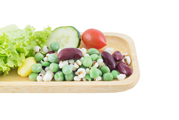 Cereal Grains and fresh vegetable on Wood tray isolated on white background, selective focus (detailed close-up shot)