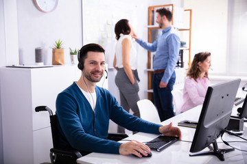 Fototapeta premium Handicapped Man Working On Computer