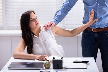 Woman Defending Herself From Sexual Harassment By Boss