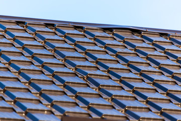 Metal roof in the house against the sky
