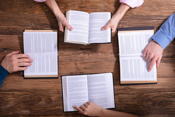 Fototapeta na wymiar Group Of People Reading Holy Books