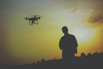 Fototapeta na wymiar drone flying silhouette