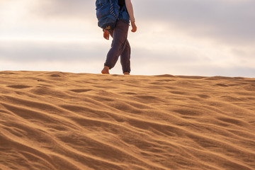 people walk in the sand desert