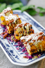 mexican spicy bbq corn tapas snack with chilli sauce and cheese