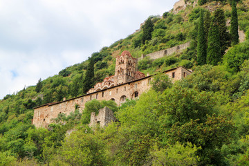 Fototapeta na wymiar View to the Pantanassa Monastery surrounded by ruins of abandoned byzantine town Mystras, Greece