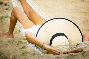 Woman on a hammock at the beach
