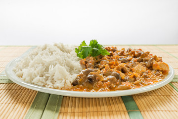 Pork meat. Stew of pork (loin) with honey mushrooms and rice basmati