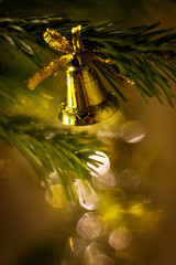 Golden Christmas tree decoration on the tree branch