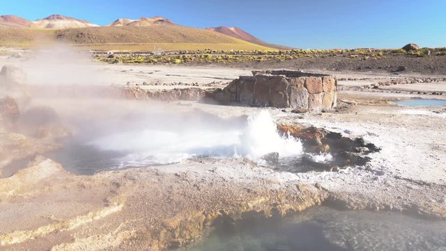 El Tatio Geysers at Atacama desert, amazing thermal spring waters at 4500 masl inside Andes mountains a place with an awe geothermal activity below the ground. Volcanic activity at Atacama scenery