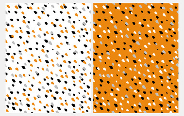 Set of 2 Abstract Seamless Vector Patterns with Hand Drawn Irregular Dots on a White and Orange Background. Black, Gray, White and Orange Geometric Dotted Design. Funny Repeatable Party Layouts. 