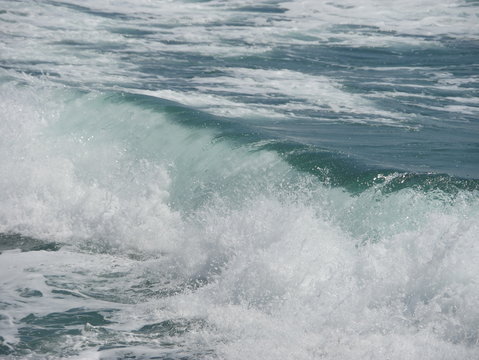 waves crashing on the beach © hoshi