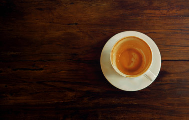 Coffee Cup on Wooden Table. Finished Latte or Cappuccino. Top View