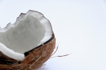 Close-up of a broken coconut isolated on a white background