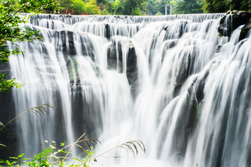 view of beautiful giant waterfall in rainforest