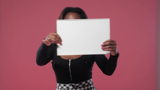 the girl is spinning a sign