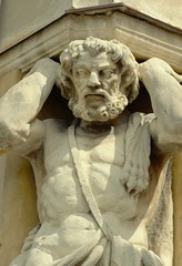 Naklejka premium Statue of Atlanta (Corgon). The monumental stone statue of Atlanta, bearing the corner of the first floor, attracts attention to the building.