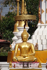 Gold buddha images in the style of Chiang Saen or Lanna in a sitting position