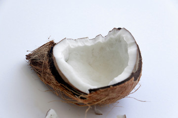 Close-up of a broken coconut isolated on a white background