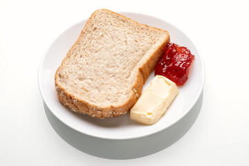 whole wheat bread, butter and jam for breakfast