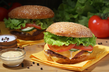 Two fresh hamburgers with vegetables