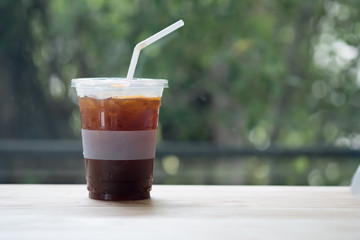 Iced americano coffee on wood table
