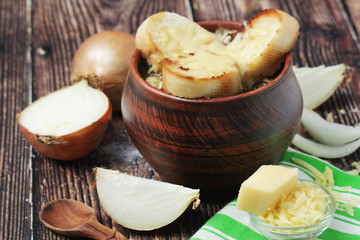 A ceramic pot with French onion soup