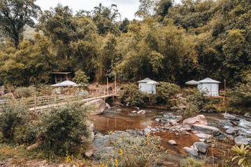 Accommodation white tent near the small river in Nan Province, Thailand.