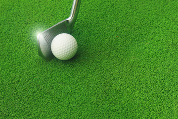 Golf balls and golf clubs on green grass.Golf equipment in the top view.Sports that people around the world play during the holidays for health.