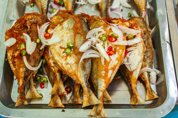 Fried mackerel at market's street in Thailand.