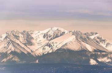Fototapeta na wymiar Snowy peaks of the Tatra Mountains at dawn