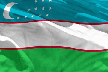 Waving Uzbekistan flag for using as texture or background, the flag is fluttering on the wind