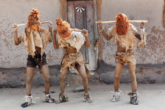 Traditional Nyau dancers with face masks at a Gule Wamkulu ceremony in a small village near Lilongwe, Malawi