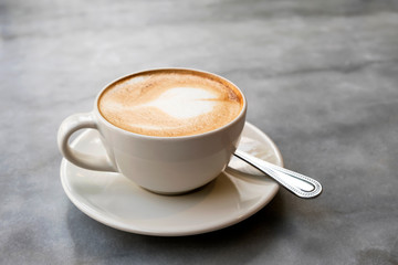Aromatic latte coffee on the marble table