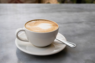Aromatic latte coffee on the marble table