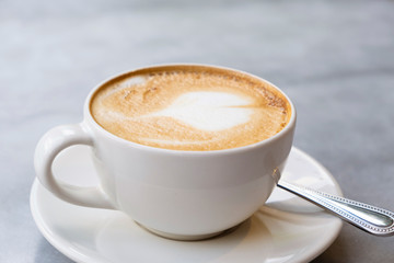 Aromatic latte coffee on the marble table