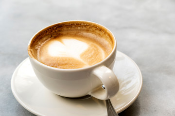 Aromatic latte coffee on the marble table